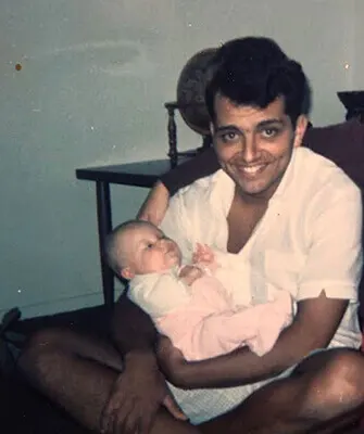 Bill Nacca Holds His First Born Daughter
